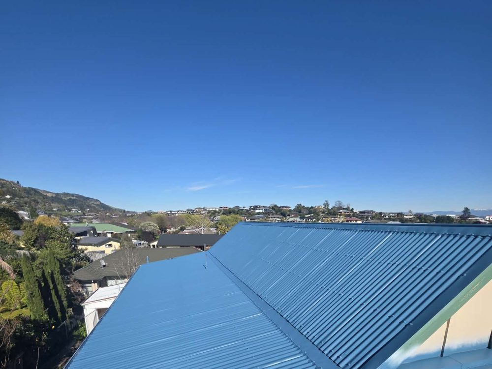 The same roof repainted a bright, even blue